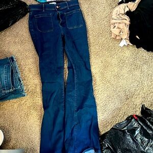 Denim dark blue flair jeans very high-rise.